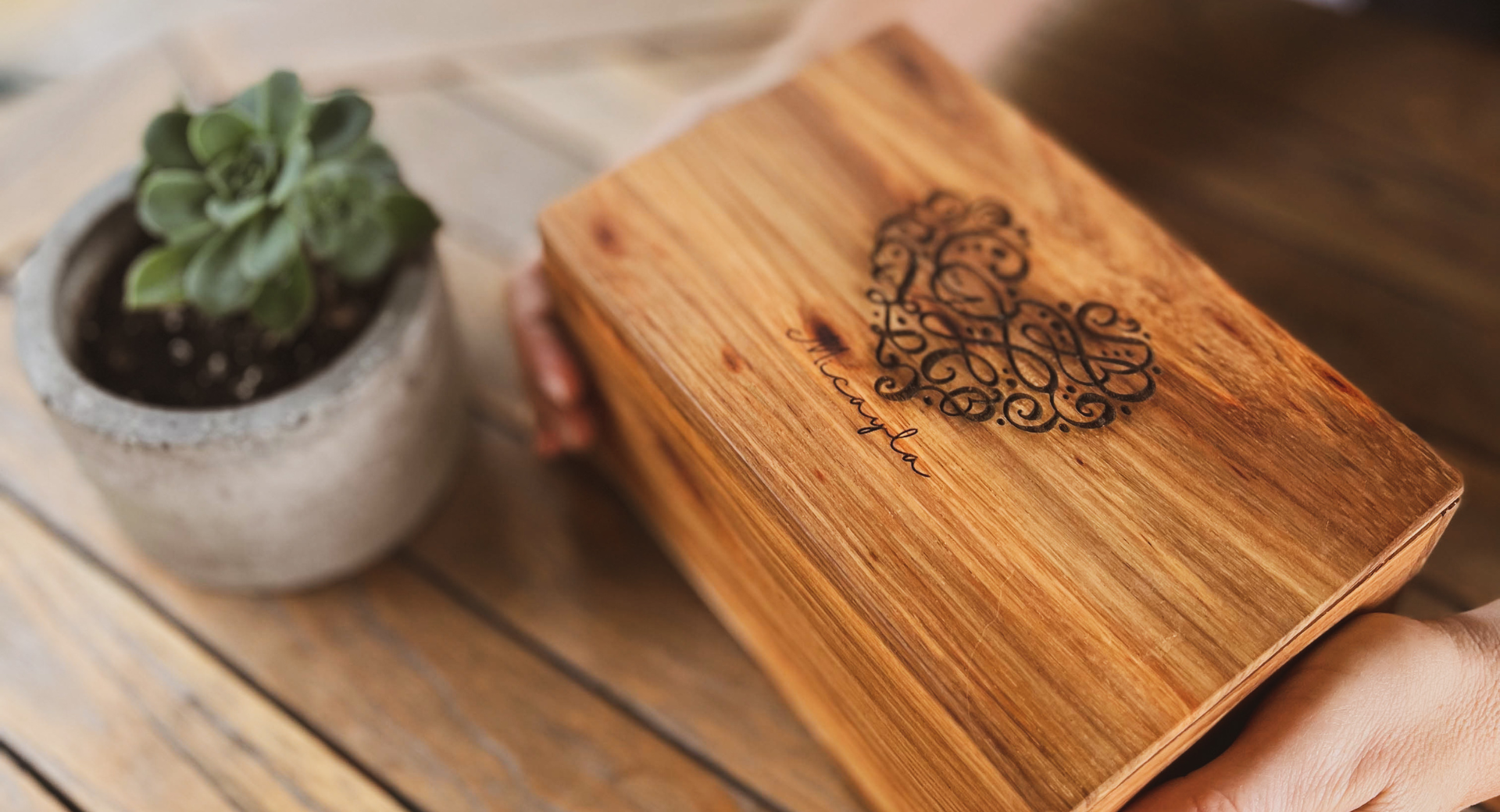 Close-up of premium South African Kiaat wood grain used in handcrafted music boxes